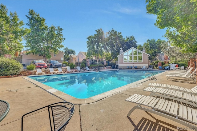 14243 E Radcliff Cir, Aurora, CO 80015 - community pool featuring a patio and a residential view