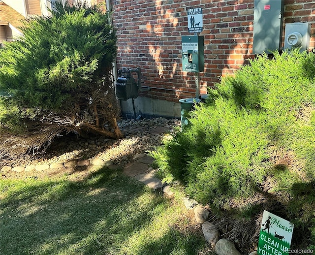 14243 E Radcliff Cir, Aurora, CO 80015 - exterior view of brick siding and gas meter
