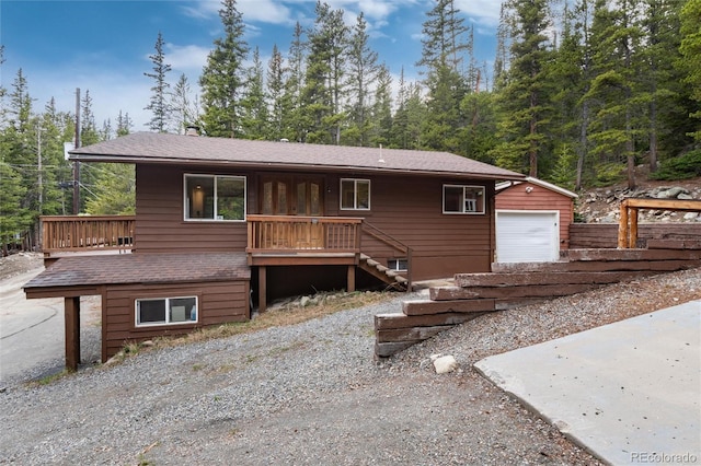 159 Lake Rd, Idaho Springs, CO 80452 - view of front facade with an outbuilding, stairway, a porch, and a garage