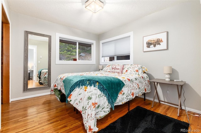 159 Lake Rd, Idaho Springs, CO 80452 - bedroom featuring wood finished floors and baseboards