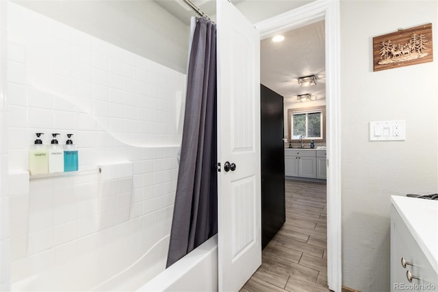 159 Lake Rd, Idaho Springs, CO 80452 - full bath with vanity, shower / bathtub combination with curtain, wood finished floors, and recessed lighting