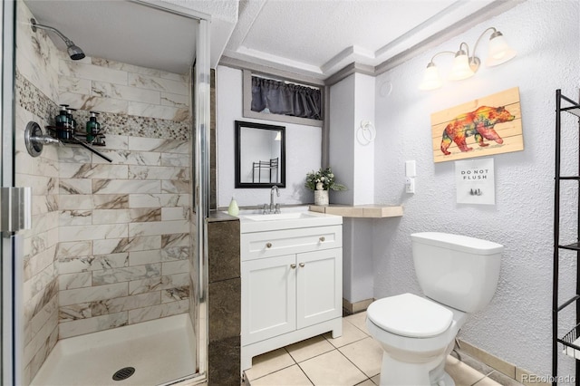 159 Lake Rd, Idaho Springs, CO 80452 - full bath featuring a stall shower, toilet, vanity, tile patterned floors, and a textured wall