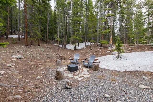 159 Lake Rd, Idaho Springs, CO 80452 - view of yard featuring a forest view and an outdoor fire pit