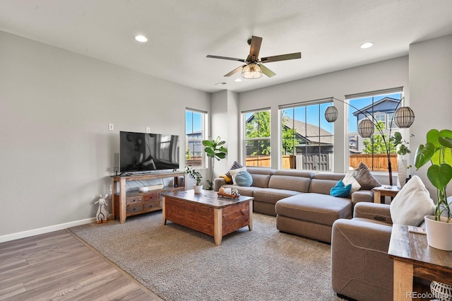 27893 E 6th Pl, Aurora, CO 80018 - living area featuring wood finished floors, baseboards, a ceiling fan, and recessed lighting