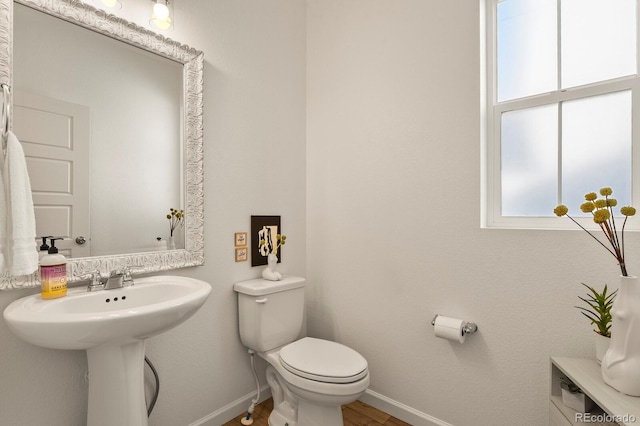 27893 E 6th Pl, Aurora, CO 80018 - bathroom with baseboards, toilet, and wood finished floors