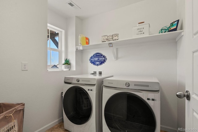 27893 E 6th Pl, Aurora, CO 80018 - laundry room with washer and clothes dryer and baseboards
