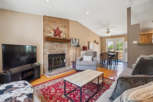 19061 E Oxford Dr, Aurora, CO 80013 - living room with vaulted ceiling, a ceiling fan, wood finished floors, a fireplace, and recessed lighting