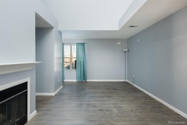 unfurnished living room with hardwood / wood-style flooring