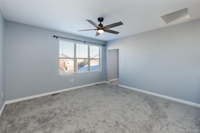 empty room with carpet flooring and ceiling fan