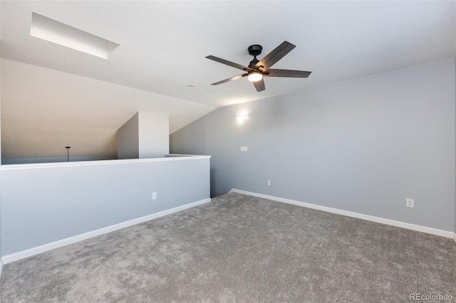 additional living space featuring ceiling fan, carpet, and vaulted ceiling