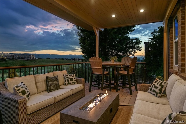 10258 Pennington Ln, Highlands Ranch, CO 80126 - deck featuring an outdoor living space with a fire pit and outdoor dining space