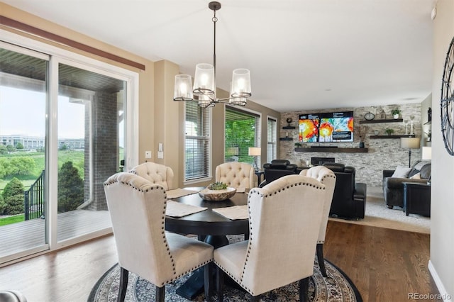 10258 Pennington Ln, Highlands Ranch, CO 80126 - dining room featuring a chandelier and wood finished floors