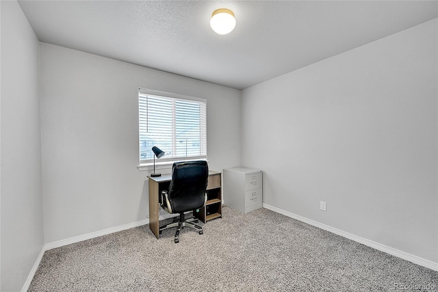 6626 Mandan Dr, Colorado Springs, CO 80925 - office featuring baseboards, light carpet, and a textured ceiling