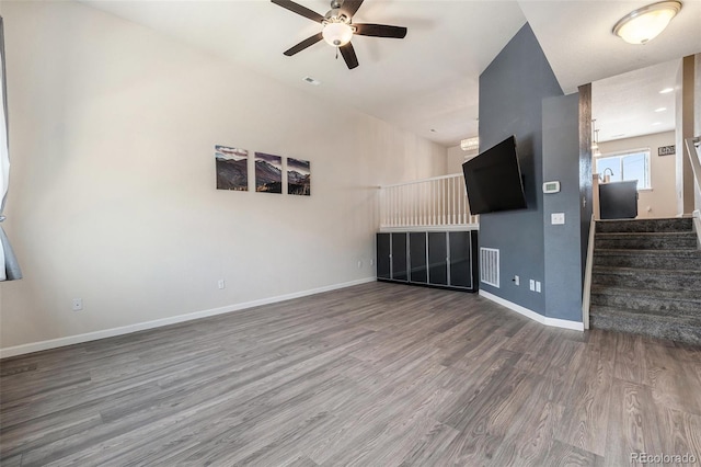 1732 Aspen Meadows Cir, Federal Heights, CO 80260 - unfurnished living room featuring a ceiling fan, wood finished floors, and stairway