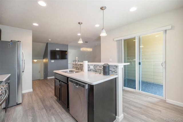 1732 Aspen Meadows Cir, Federal Heights, CO 80260 - kitchen with stainless steel appliances, light wood-type flooring, light countertops, a center island with sink, and recessed lighting