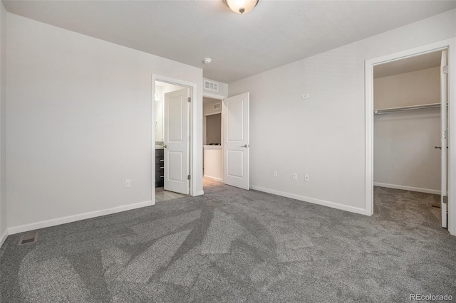 1732 Aspen Meadows Cir, Federal Heights, CO 80260 - unfurnished bedroom featuring carpet, a spacious closet, and a closet