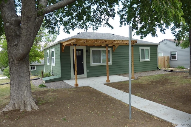 3575 W 9th Ave, Denver, CO 80204 - bungalow-style house featuring a patio area and a shingled roof