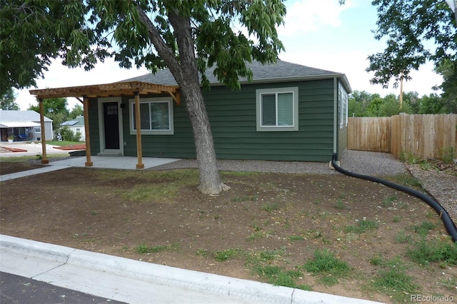 3575 W 9th Ave, Denver, CO 80204 - view of front of property with a patio and a shingled roof
