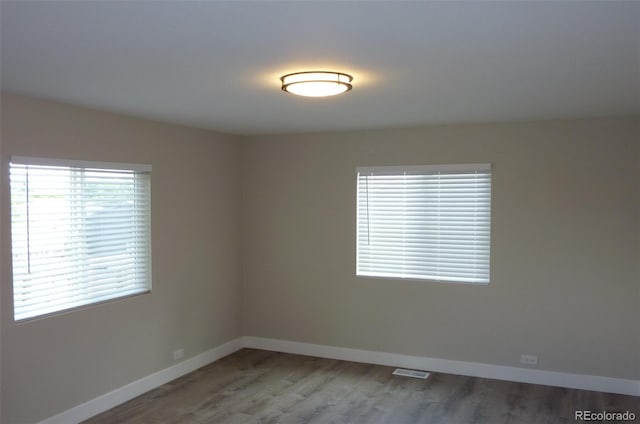 3575 W 9th Ave, Denver, CO 80204 - spare room with baseboards and wood finished floors
