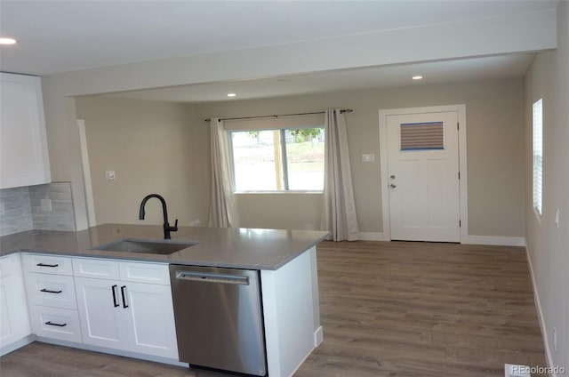 3575 W 9th Ave, Denver, CO 80204 - kitchen featuring stainless steel dishwasher, a peninsula, recessed lighting, wood finished floors, and white cabinets