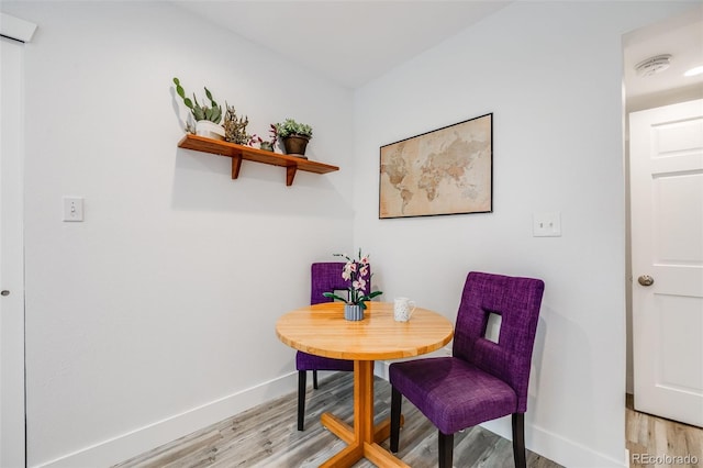 dining room with light hardwood / wood-style floors