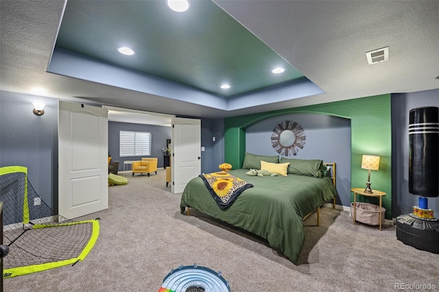 10649 Mt Emerald Dr, Peyton, CO 80831 - carpeted bedroom featuring a tray ceiling, baseboards, recessed lighting, and a textured ceiling