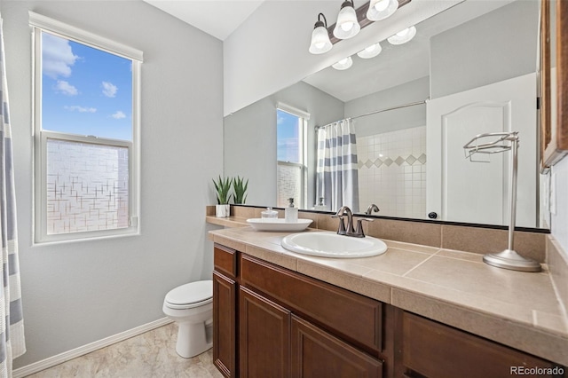 10649 Mt Emerald Dr, Peyton, CO 80831 - full bathroom featuring toilet, vanity, baseboards, and a shower with curtain
