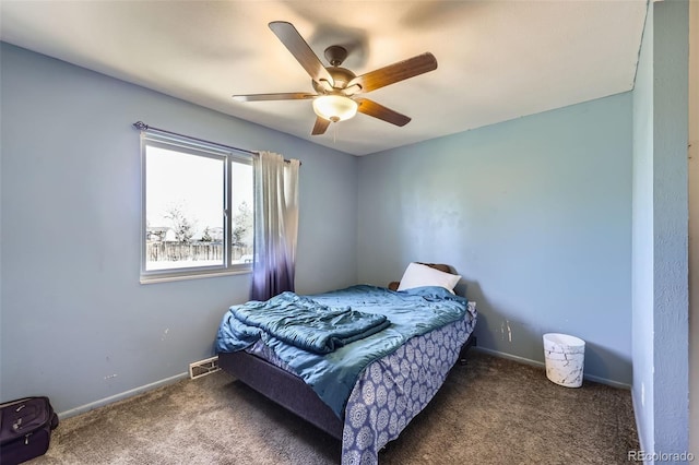 carpeted bedroom with visible vents, ceiling fan, and baseboards