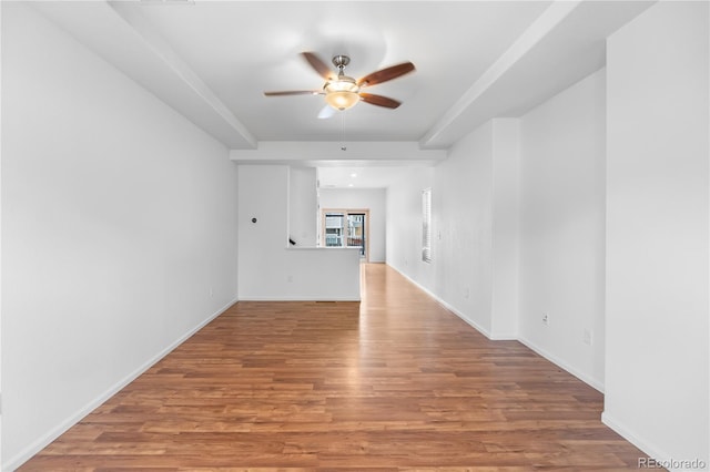 unfurnished living room with ceiling fan and hardwood / wood-style floors