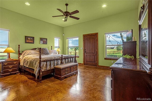 17595 Black Forest Rd, Colorado Springs, CO 80908 - bedroom with finished concrete flooring, multiple windows, recessed lighting, and ceiling fan