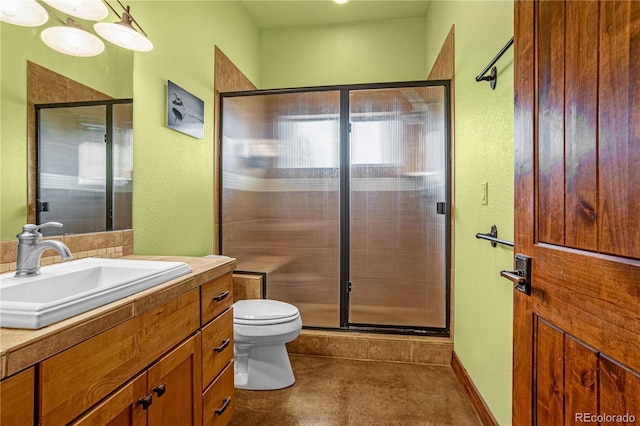 17595 Black Forest Rd, Colorado Springs, CO 80908 - bathroom with vanity, a shower stall, and a textured wall