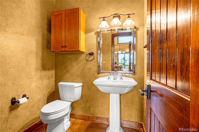 17595 Black Forest Rd, Colorado Springs, CO 80908 - half bathroom with toilet and baseboards