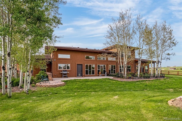 17595 Black Forest Rd, Colorado Springs, CO 80908 - back of house with a patio and stucco siding