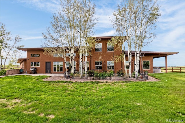 17595 Black Forest Rd, Colorado Springs, CO 80908 - back of property with stucco siding and a patio