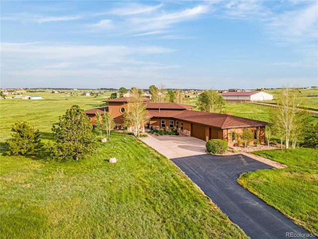 17595 Black Forest Rd, Colorado Springs, CO 80908 - view of green lawn featuring an attached garage and driveway