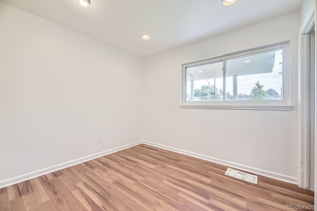 1325 Lima St, Aurora, CO 80010 - spare room featuring light wood finished floors and recessed lighting