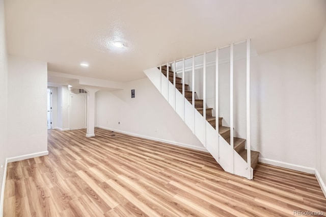 1325 Lima St, Aurora, CO 80010 - finished basement featuring stairs, light wood-style flooring, and recessed lighting