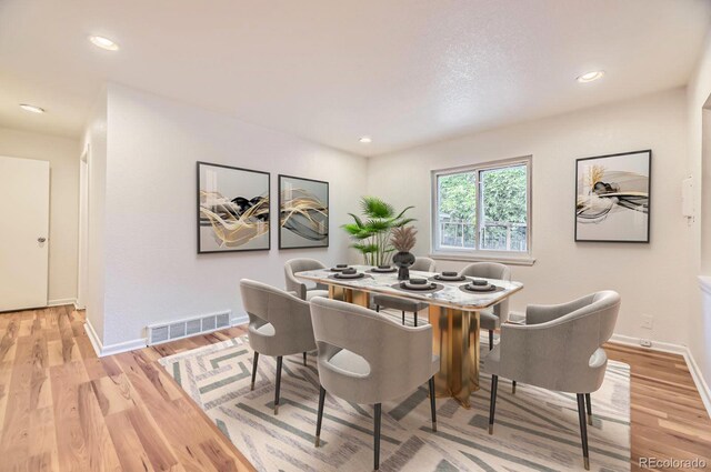 1325 Lima St, Aurora, CO 80010 - dining room featuring light wood-type flooring, baseboards, and recessed lighting