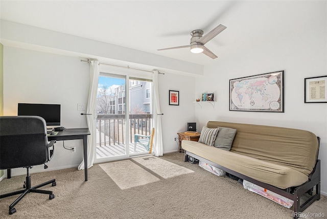 home office with carpet, ceiling fan, and baseboards