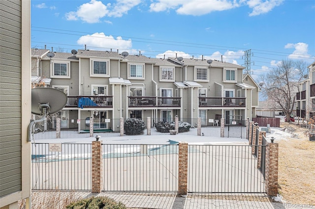 exterior space with a residential view and fence