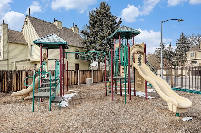 community jungle gym featuring fence