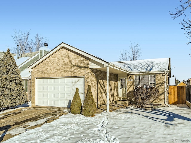 single story home featuring a garage