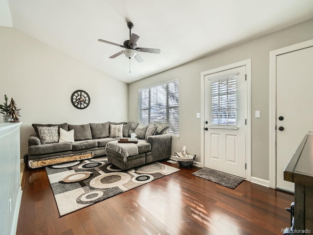 living room with vaulted ceiling, ceiling fan, and dark hardwood / wood-style floors