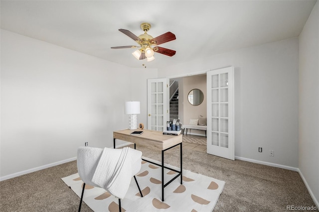 carpeted office space with ceiling fan, french doors, and baseboards