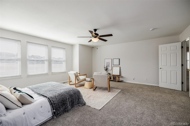 bedroom with baseboards, a ceiling fan, and carpet flooring