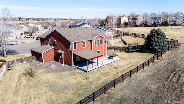 birds eye view of property with a residential view