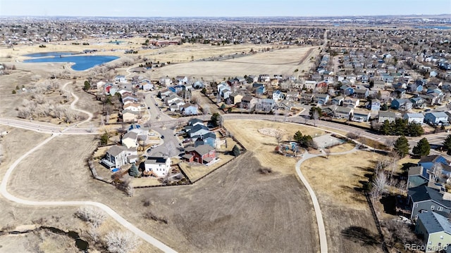 birds eye view of property with a residential view