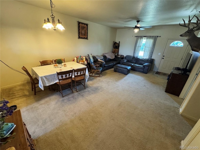 2874 Rose Hill St, Strasburg, CO 80136 - carpeted living room featuring a chandelier and ceiling fan