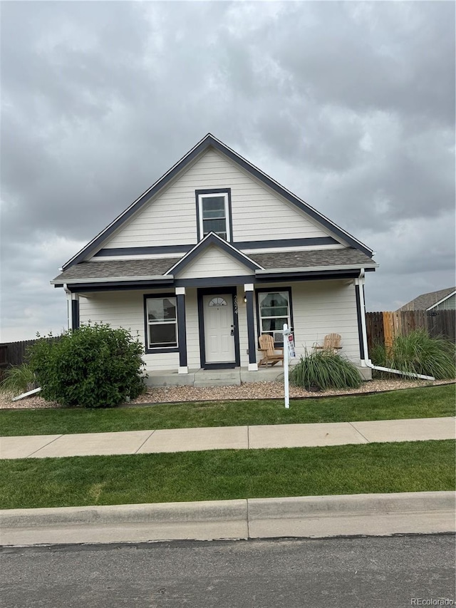 2874 Rose Hill St, Strasburg, CO 80136 - view of front of house with roof with shingles and covered porch