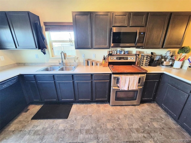 2874 Rose Hill St, Strasburg, CO 80136 - kitchen featuring stainless steel appliances, light countertops, and stone finish floors